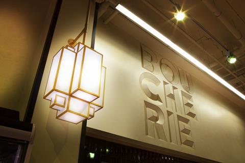 The store applies this 1930s aesthetic throughout the store, from lights to mid-shop columns.